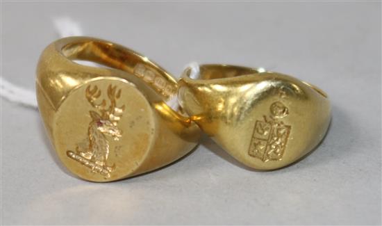 An 18ct gold signet ring and a similar yellow metal signet ring.